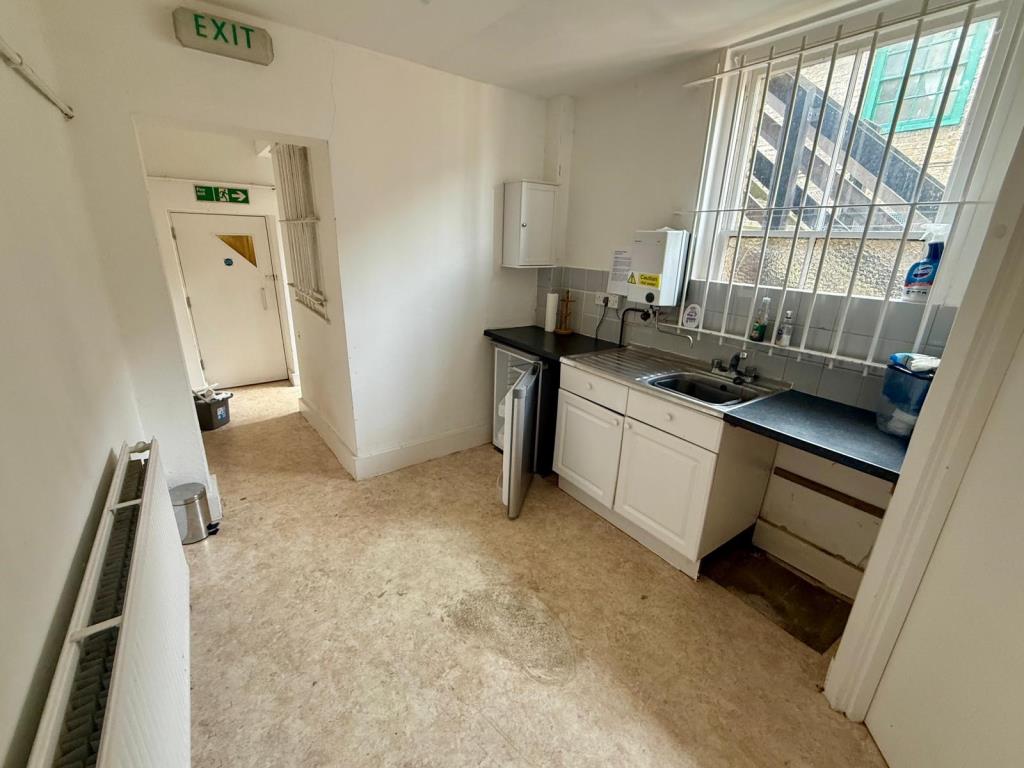 Lot: 64 - HIGH STREET COMMERCIAL PREMISES WITH UPPER PARTS AND PARKING - Ground floor kitchen